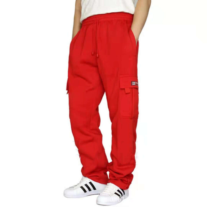 Men's red jogger sweatpants with drawstring and side pockets, styled for comfort and casual wear.