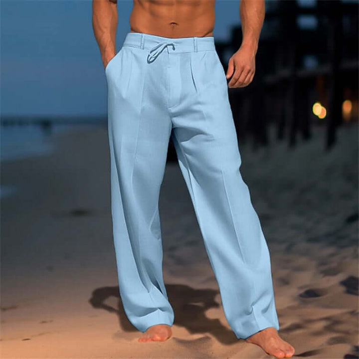 Light blue wide-leg drawstring pants for men, showcasing relaxed fit and comfort on the beach.