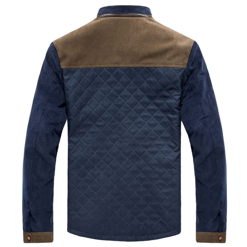Back view of an autumn corduroy men's jacket in navy blue with a brown yoke and diamond quilted pattern.
