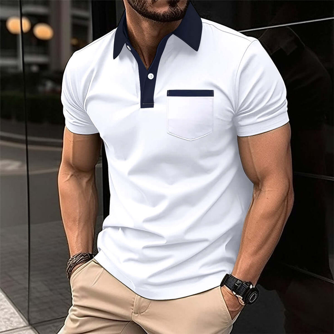 Stylish men's short-sleeved polo shirt in white with navy collar and pocket, perfect for casual or semi-formal occasions.