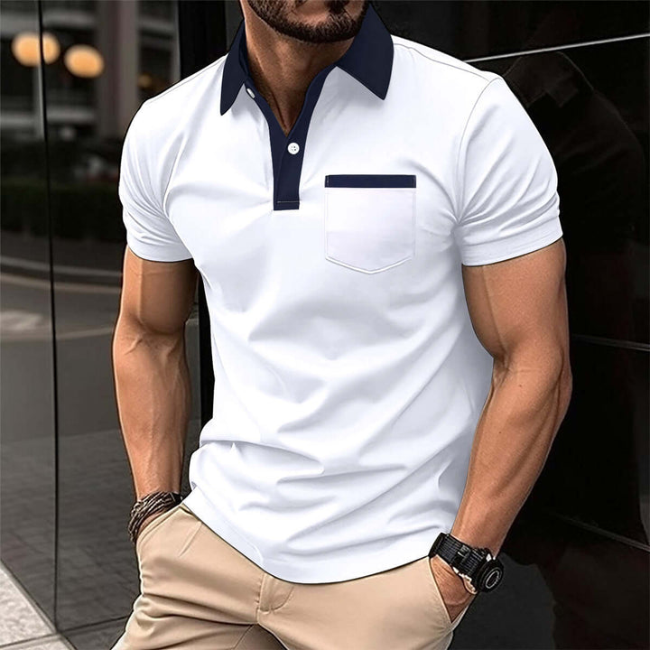 Stylish men's short-sleeved polo shirt in white with navy collar and pocket, perfect for casual or semi-formal occasions.