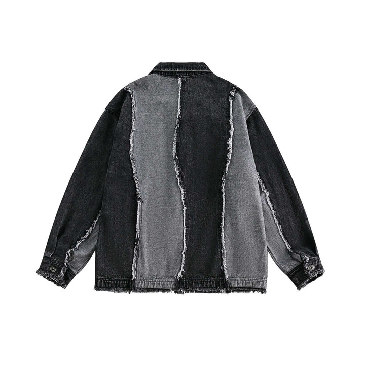 Back view of men's two-tone denim jacket with distressed details and stitching.