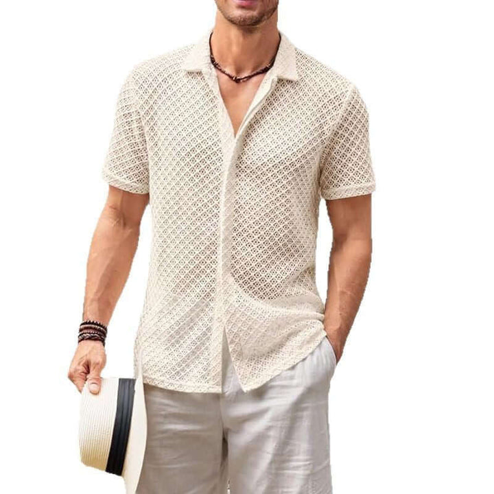 Men's summer mesh shirt in cream, styled with shorts and a hat for warm-weather casual looks.