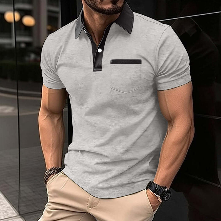 Men's short-sleeved polo shirt in light gray with black collar and pocket, perfect for casual and semi-formal occasions.
