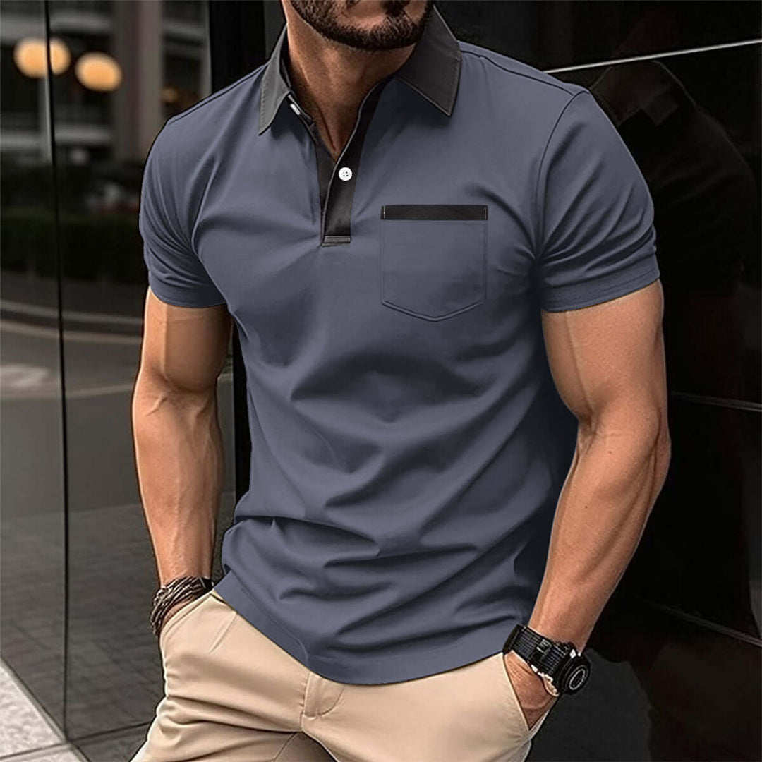 Men's short-sleeved polo shirt in navy blue with classic collar and sleek design, perfect for casual or semi-formal occasions.