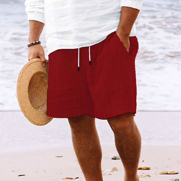 Men's summer fashion drawstring shorts in red, perfect for beach days and warm weather lounging.