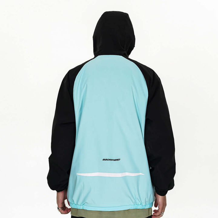 Back view of men's sun-protective wind coat featuring a turquoise body and black sleeves with adjustable hood.