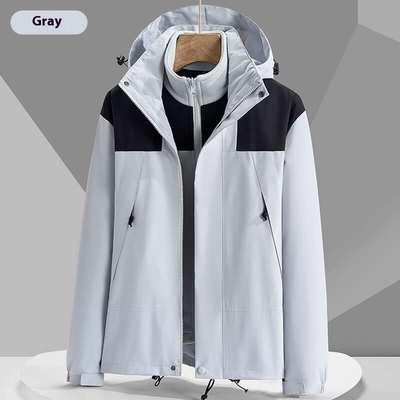Lightweight waterproof colorblock windbreaker jacket in gray with a hood, ideal for outdoor activities and urban wear.