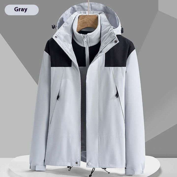 Lightweight waterproof colorblock windbreaker jacket in gray with a hood, ideal for outdoor activities and urban wear.