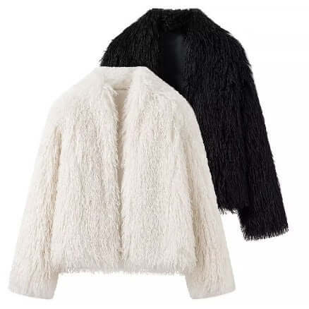 Women's fashionable street jacket in black and white faux fur, perfect for urban adventures and chic streetwear outfits.