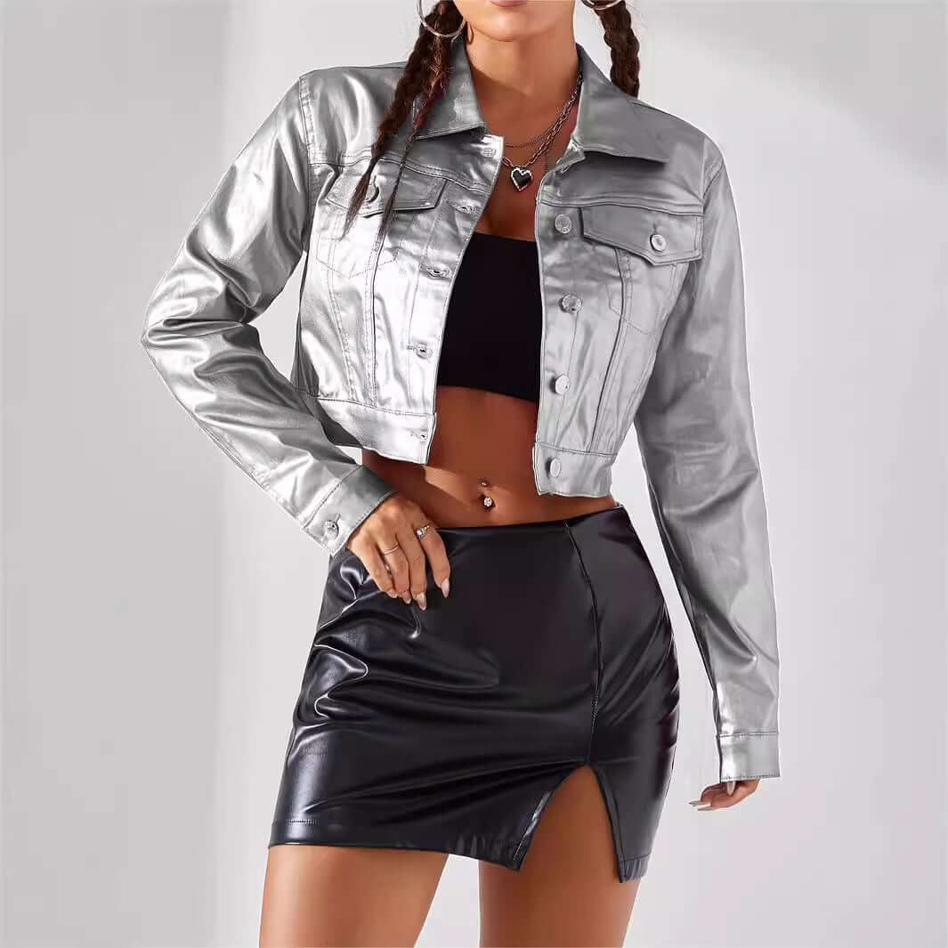 Women's street style coated jacket in silver with cropped design, paired with a black skirt for a bold urban look.